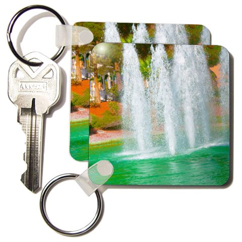 A beautiful fountain of water on a green pond – Set Of 2 Key Chains